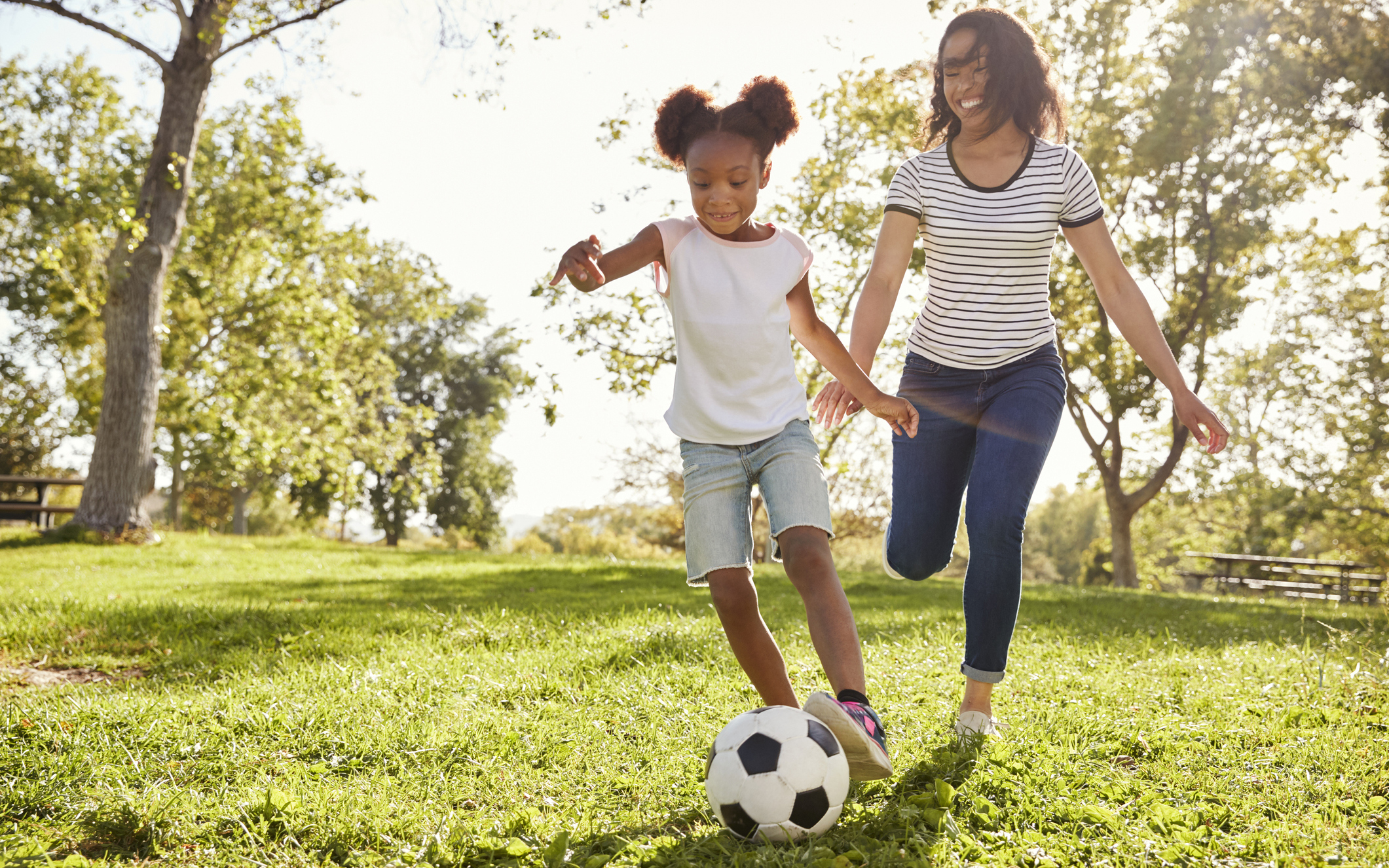 kids playing soccer in the park